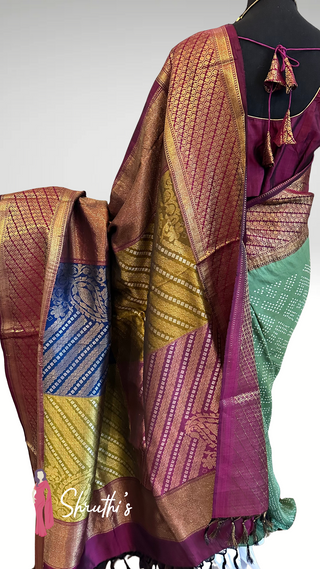 Indian wedding silk saree in mehendi green with wine-maroon temple borders.