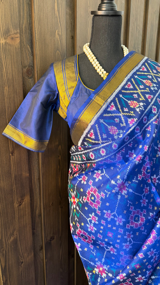 Blue patola silk saree featuring silk finish gold pallu and beautiful traditional border