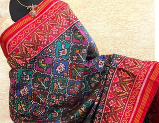 Traditional Patan Patola handloom saree crafted from fine mulberry silk with signature geometric and animal designs