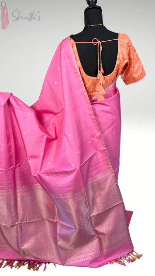 Traditional pastel pink Kanjivaram pattu saree with borderless design