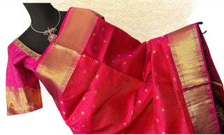 Bridal Kanjeevaram silk saree in pinkish red shade with Ikat stitched blouse, ideal for weddings and festivals.