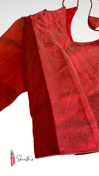 Red tissue ready blouse paired with plain silk saree for festive style