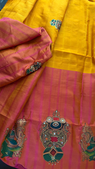 Traditional Tanjore hand painted Kanjivaram silk saree in yellow with gold detailing
