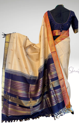 Pastel beige Ven Pattu pure Kanjivaram saree with gold zari, vintage revival pallu and Ganga Jamuna border