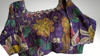 Pure Kalamkari hand-painted cotton blouse in violet with embroidered floral designs.