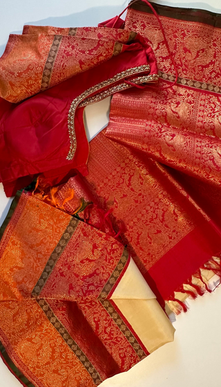 Luxury Ven Pattu silk saree in white, cream, and red shades with heavy pallu, pure zari border, and stitched blouse, ideal for weddings.