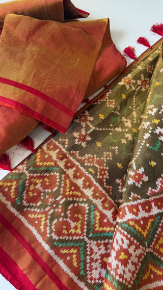 Elegant white Patola silk saree with intricate patterns, smooth silk finish, and pre-stitched blouse with alteration options, ideal for modern bridal styling.