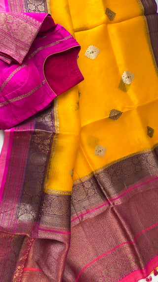 Handloom Banaras organza saree in yellow pink tones with fully stitched blouse, zari detailing, and fall pico finish.