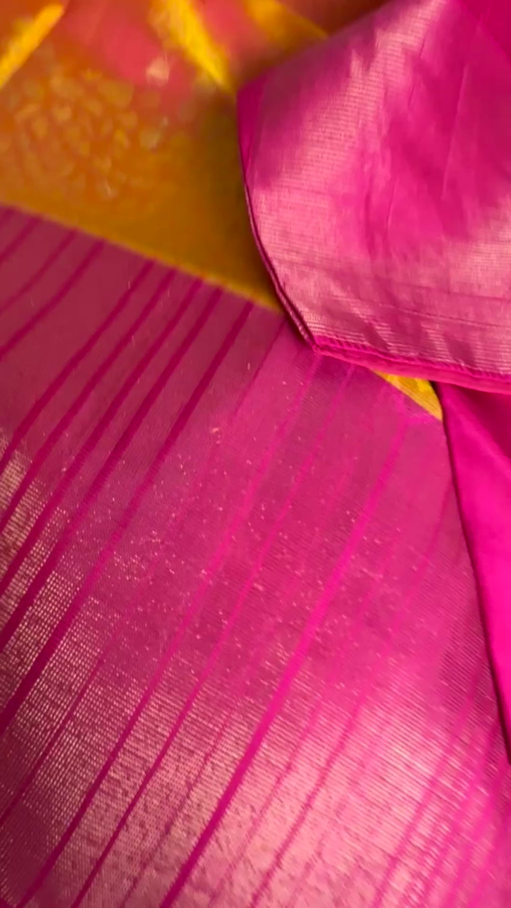 Traditional Indian wedding saree in yellow and pink hues, crafted from pure soft silk with fine handloom finish.