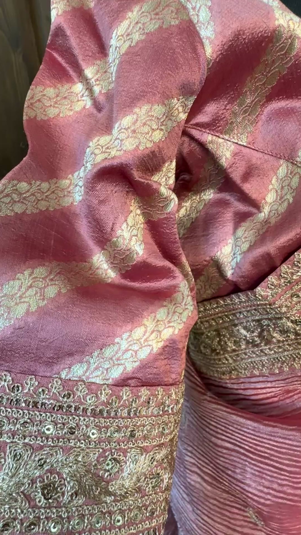 Close-up of embroidery detailing on pastel tissue silk saree border
