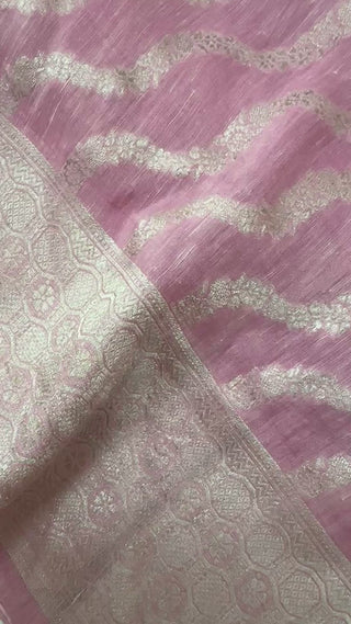 Elegant pastel pink Banaras linen saree with silver zari border and padded blouse, lightweight and perfect for Indian weddings.