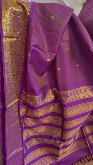 Pure kanjivaram purple silk saree featuring fine zari weave with prestitched blouse size 36–42