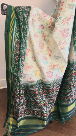 Elegant green Patan Patola saree featuring double ikat weave and premium silk texture