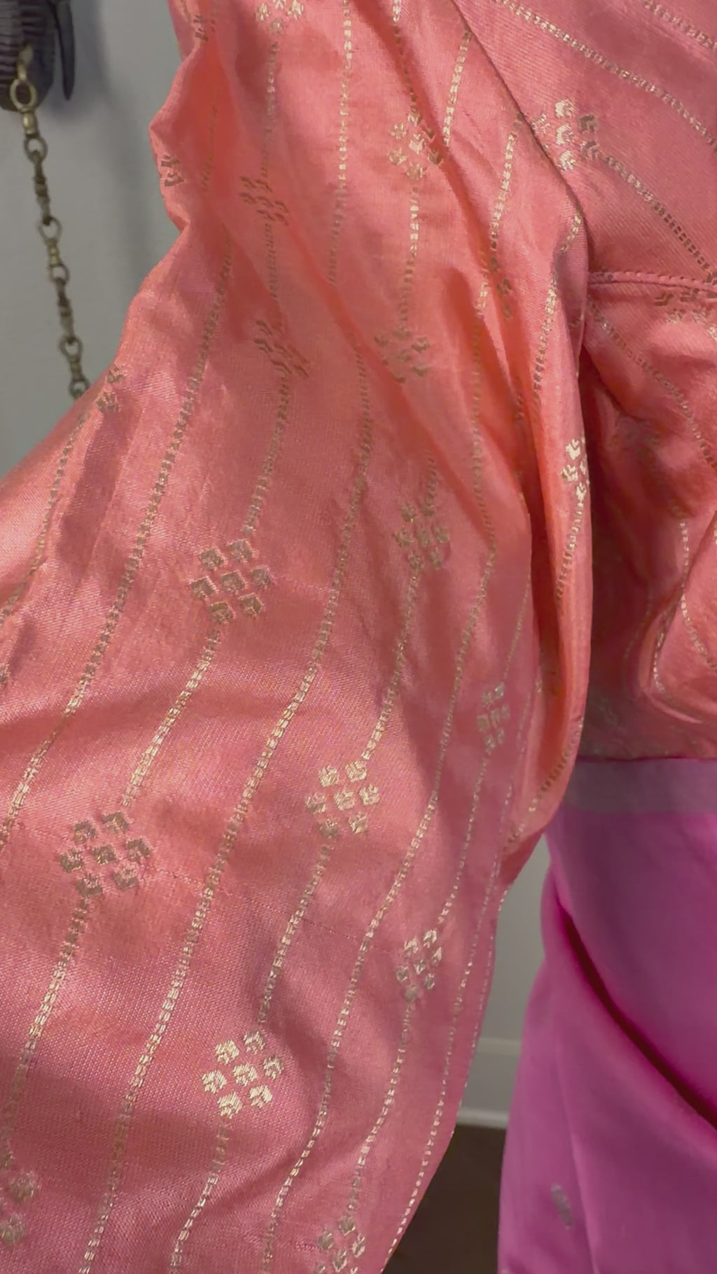 Handwoven pastel pink Kanjivaram silk saree featuring pure silver zari