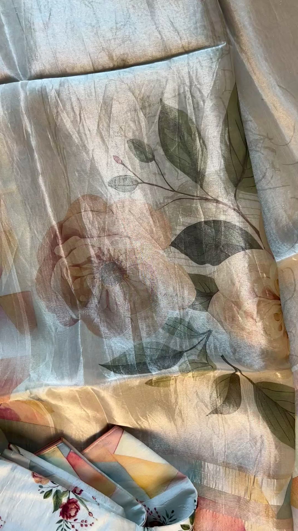 Organza silk saree in tissue finish paired with white floral blouse