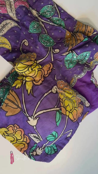 Violet hand-painted Kalamkari blouse with floral embroidery, perfect for festive occasions.