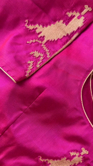 Gorgeous vibrant pink Patola silk saree handwoven with fine detailing, exuding luxury and traditional elegance.