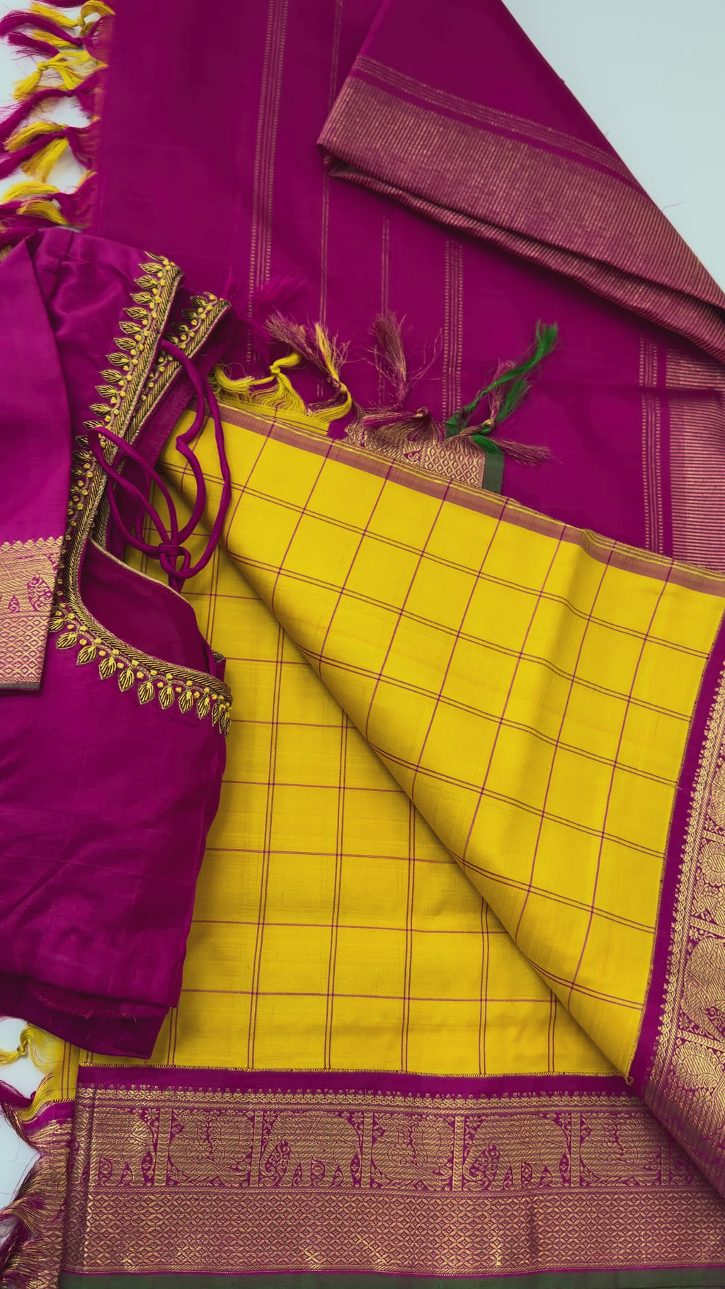 Bridal yellow pink checks handloom Kanjivaram silk saree featuring heavy pallu and elegant stitched blouse for muhurtam and reception occasions