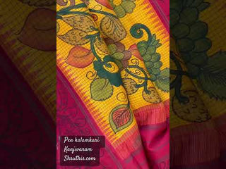 Traditional green kanchi pattu saree with hand painted pen kalamkari detailing, gold zari border and ready blouse.